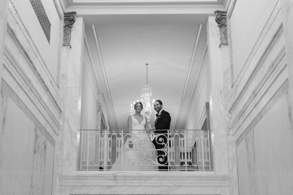 Plaza Hotel interior staircase first look with bride and groom