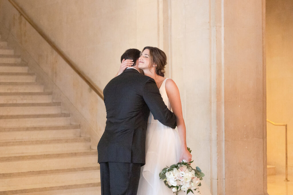 Plaza Hotel interior staircase first look with bride and groom