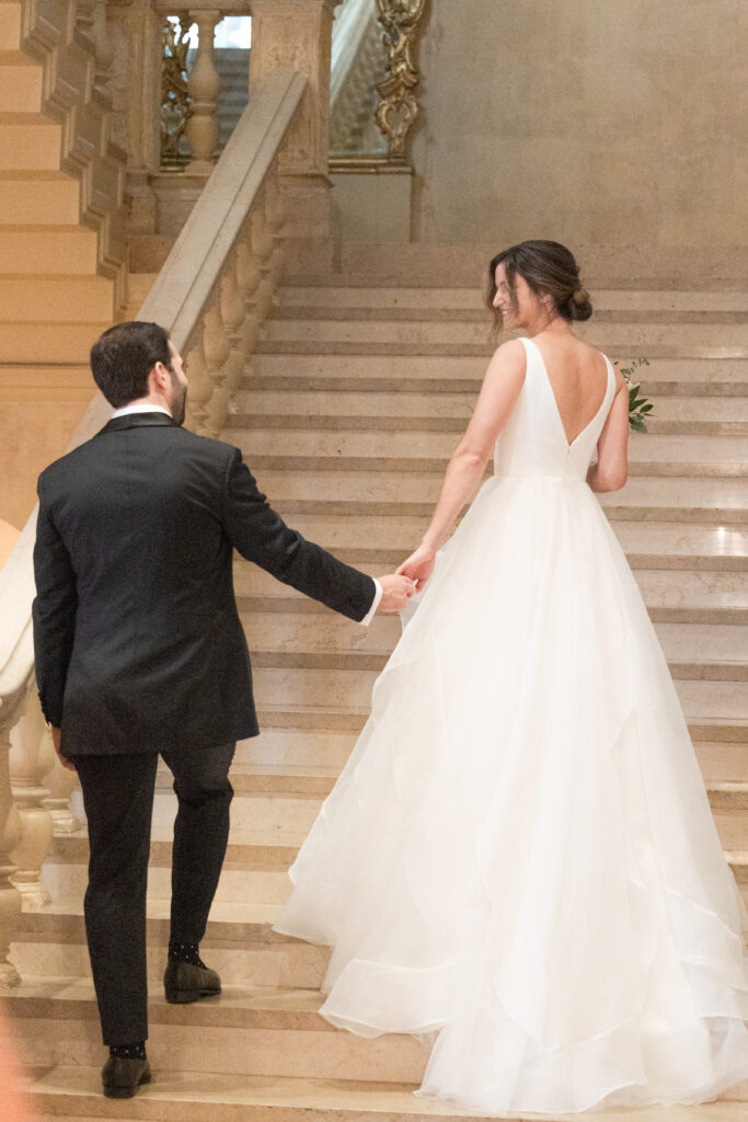 Plaza Hotel interior staircase first look with bride and groom