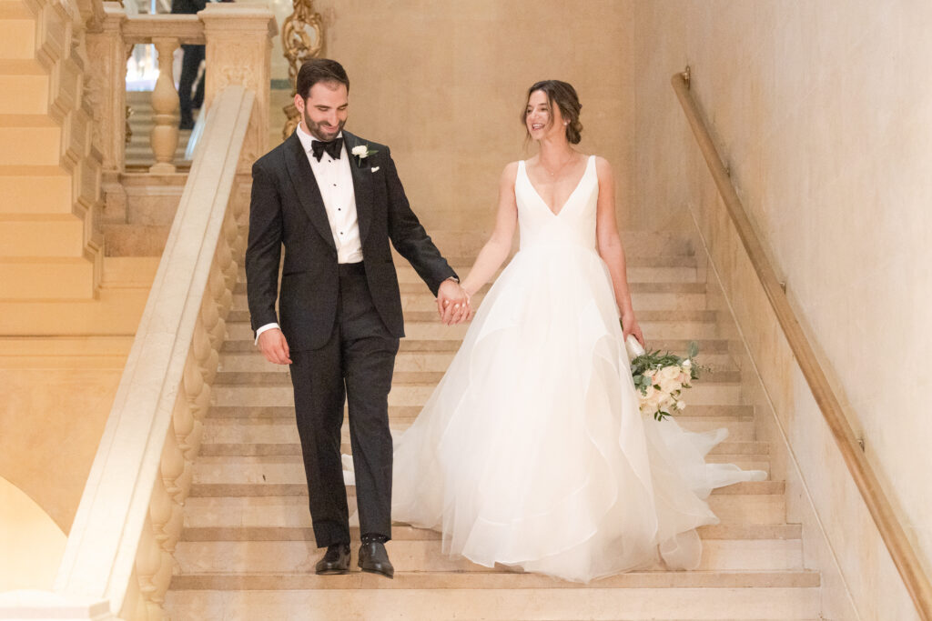 Plaza Hotel interior staircase first look with bride and groom