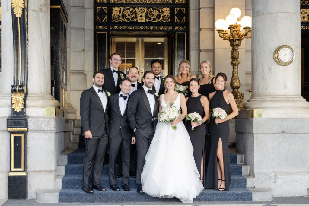 Plaza Hotel exterior portraits bride and groom with wedding party