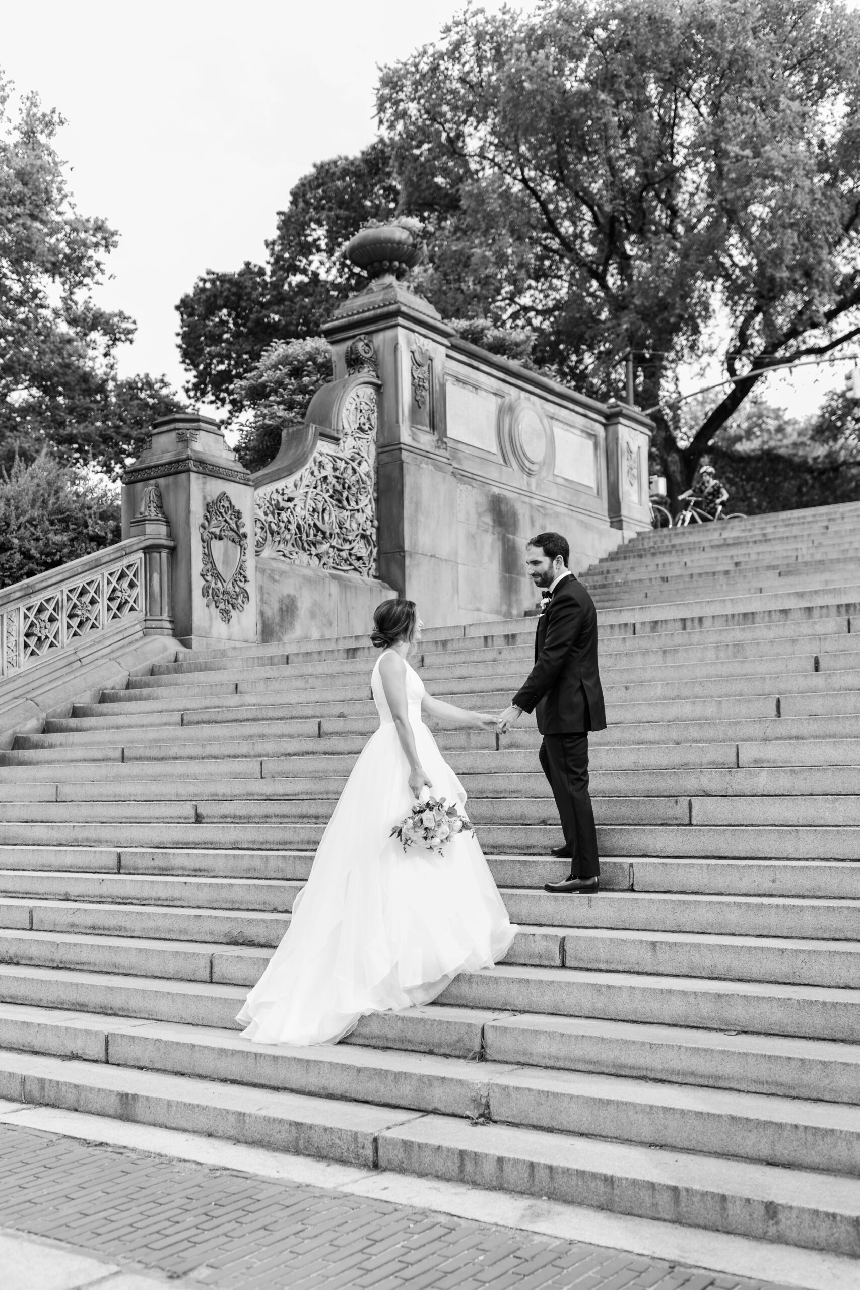 Black and white photo of bride and groom portraits at Bethesda Terrace Steps