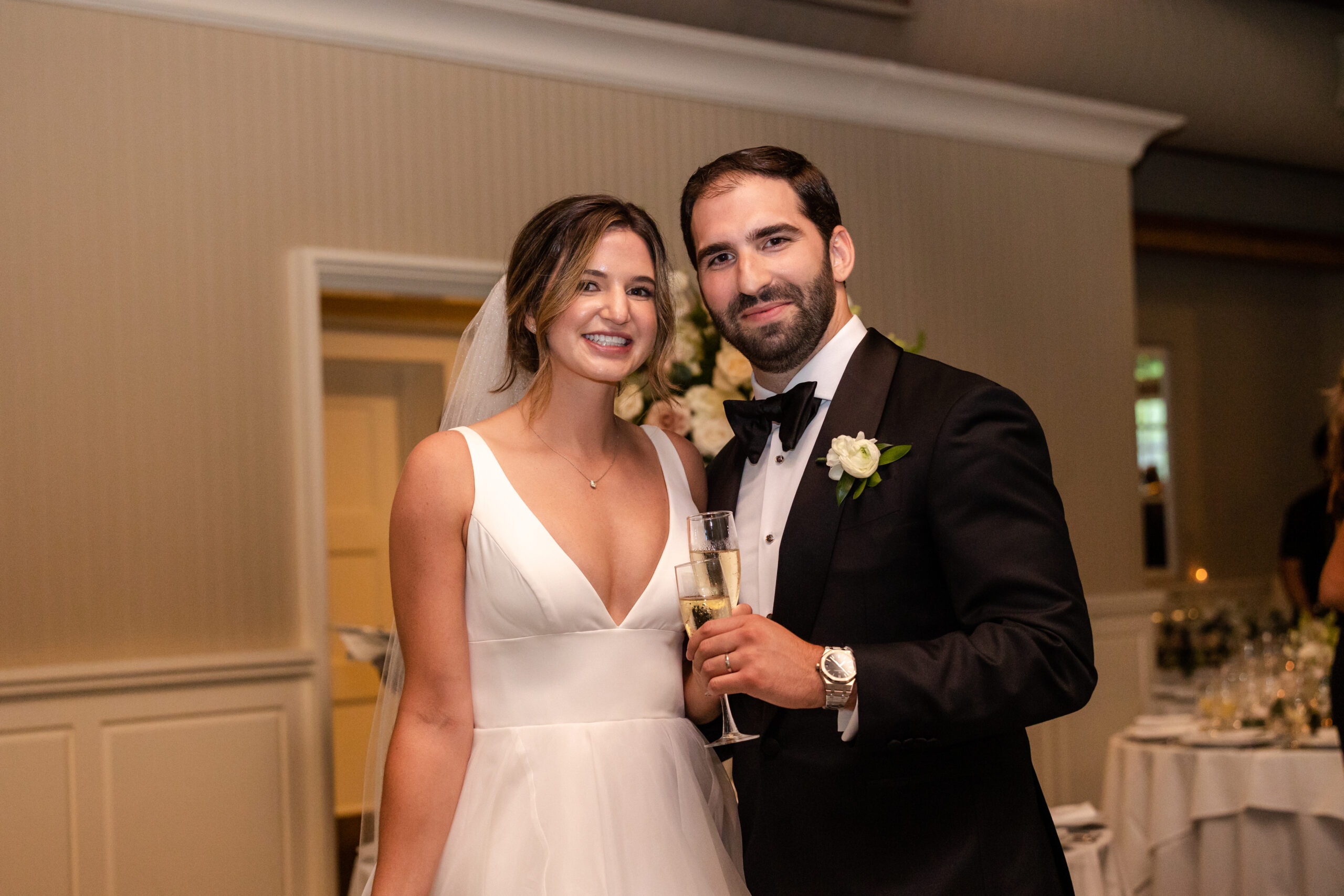 Bride and groom portraits celebrating after indoor wedding ceremony