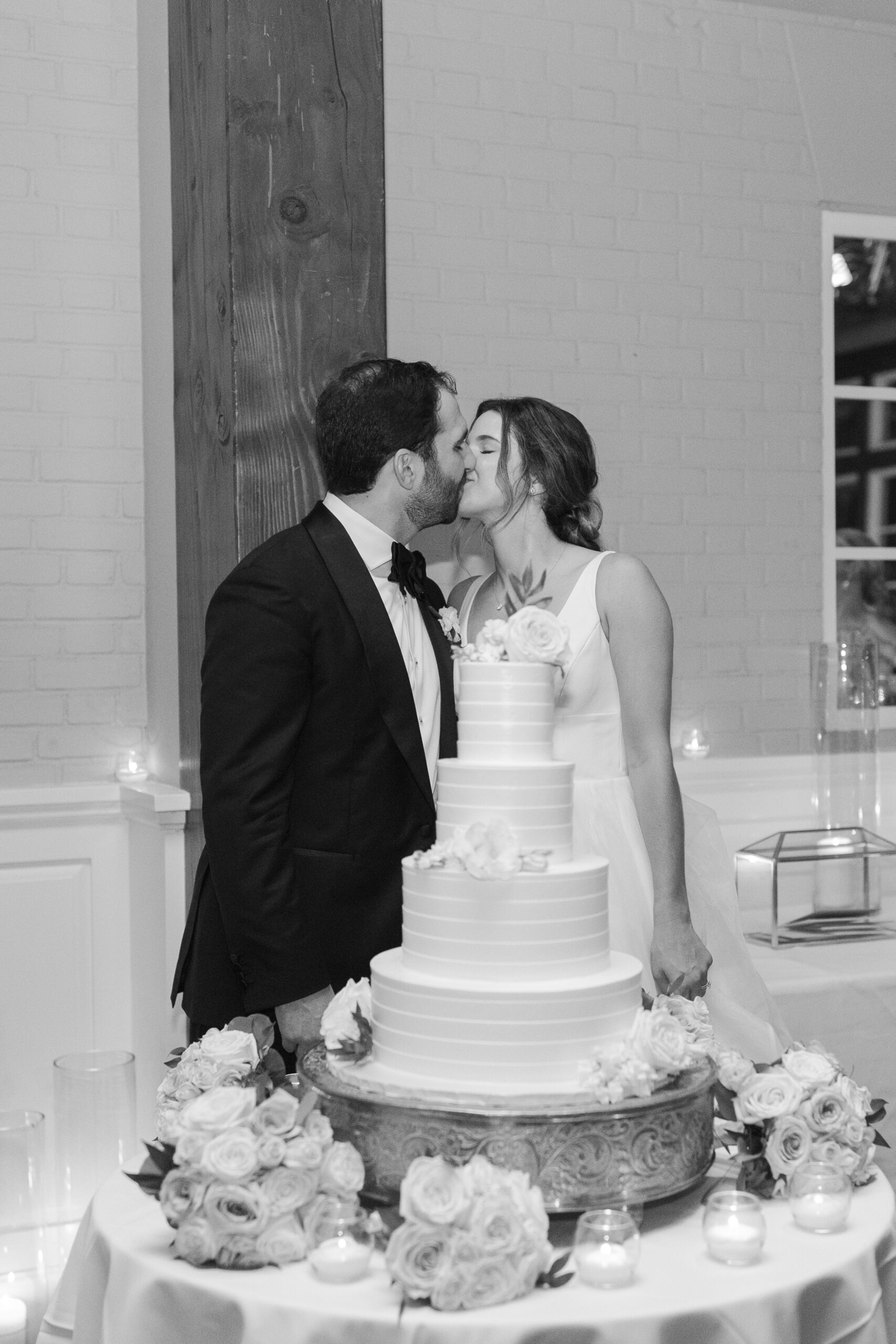Bride and Groom cutting cake at Central Park Boat House wedding reception