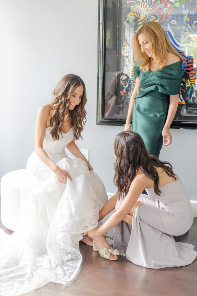 Bride getting ready with mom and sister