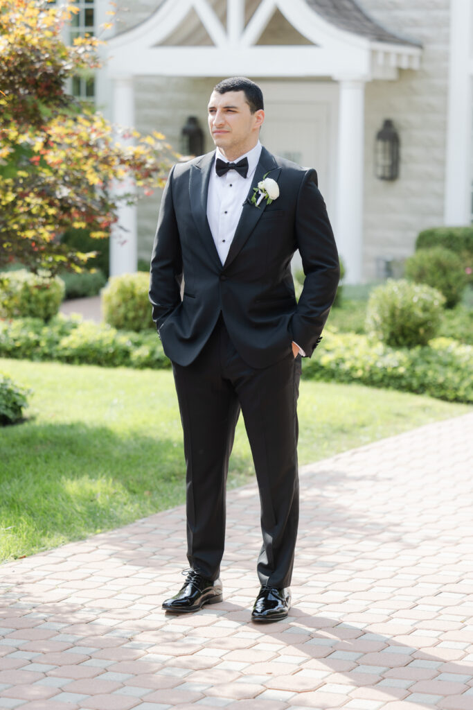 Groom first look outside of the Ryland Inn wedding venue, northern New Jersey