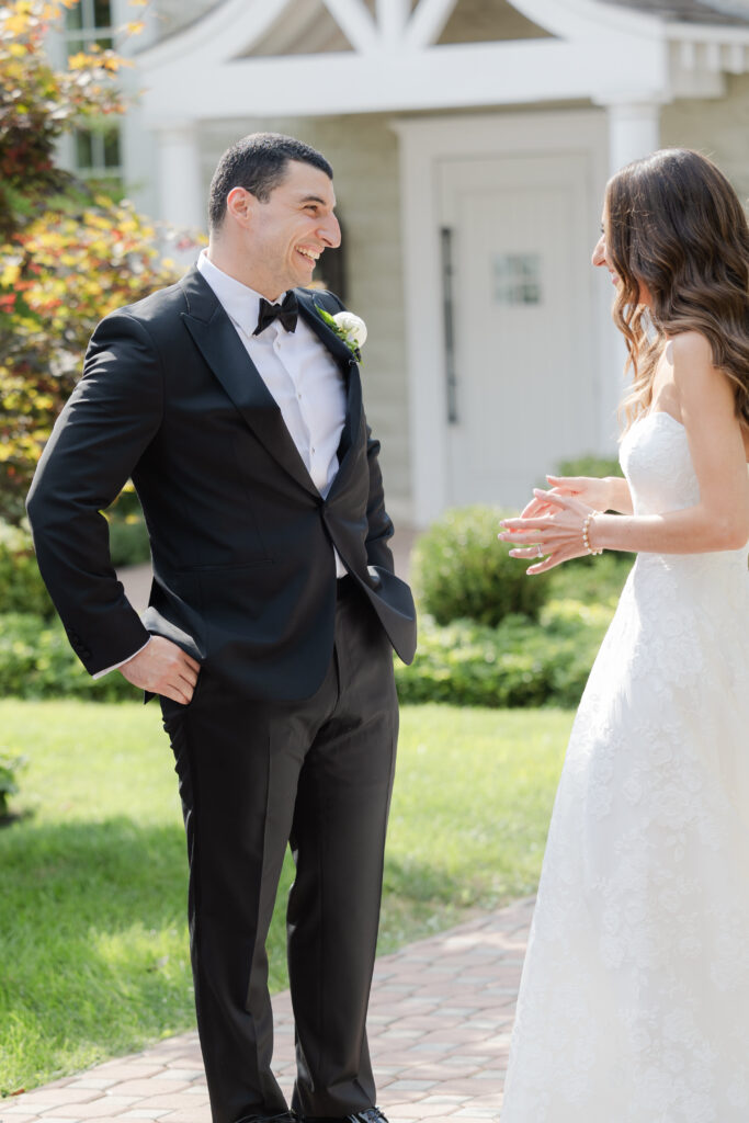 Groom first look outside of the Ryland Inn wedding venue, northern New Jersey