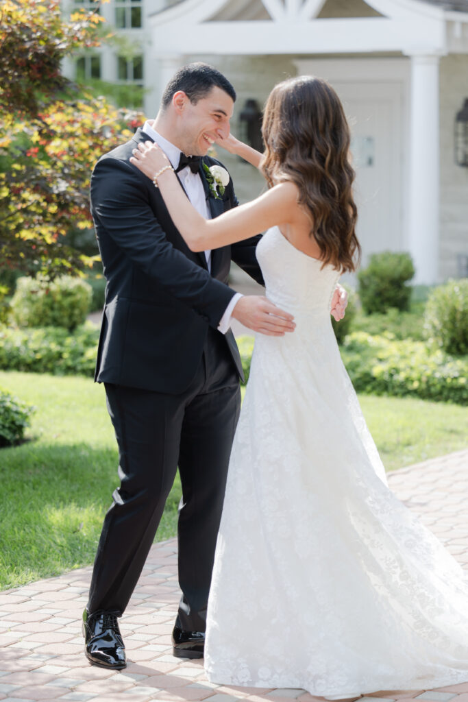 Groom first look outside of the Ryland Inn wedding venue, northern New Jersey