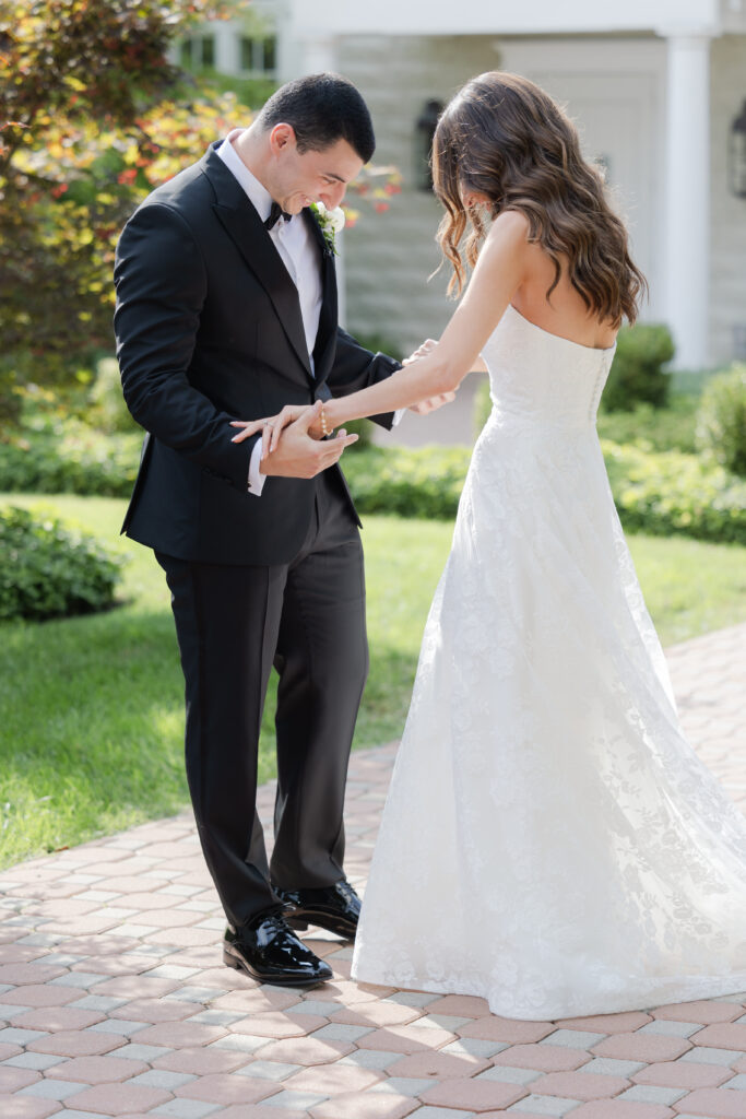 Groom first look outside of the Ryland Inn wedding venue, northern New Jersey