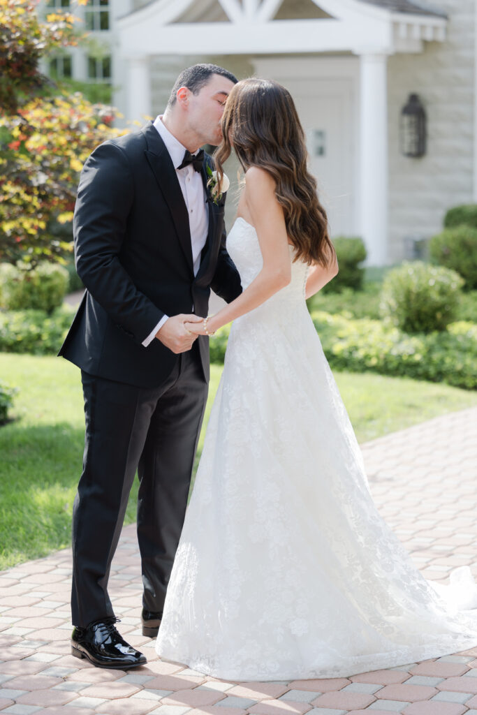 Groom first look outside of the Ryland Inn wedding venue, northern New Jersey