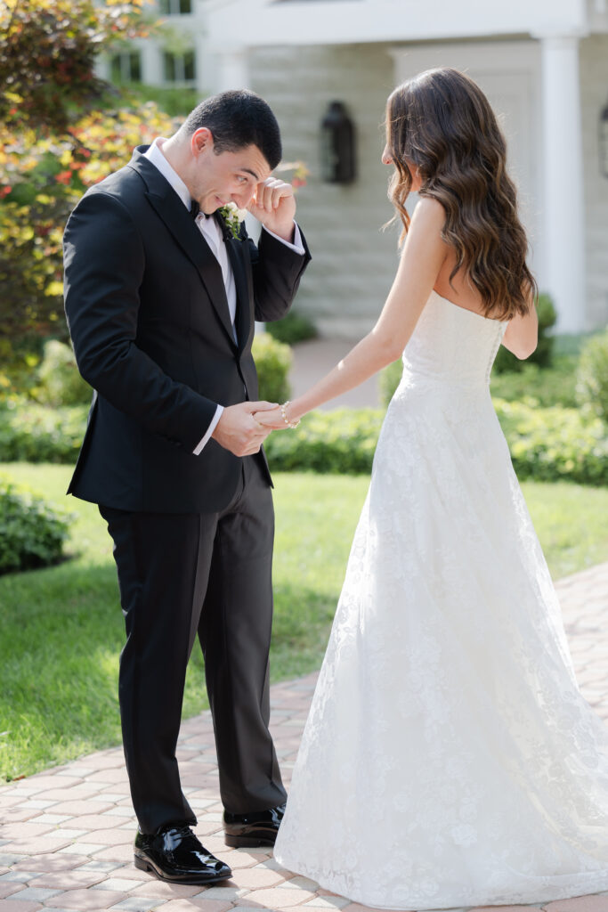 Groom first look outside of the Ryland Inn wedding venue, northern New Jersey