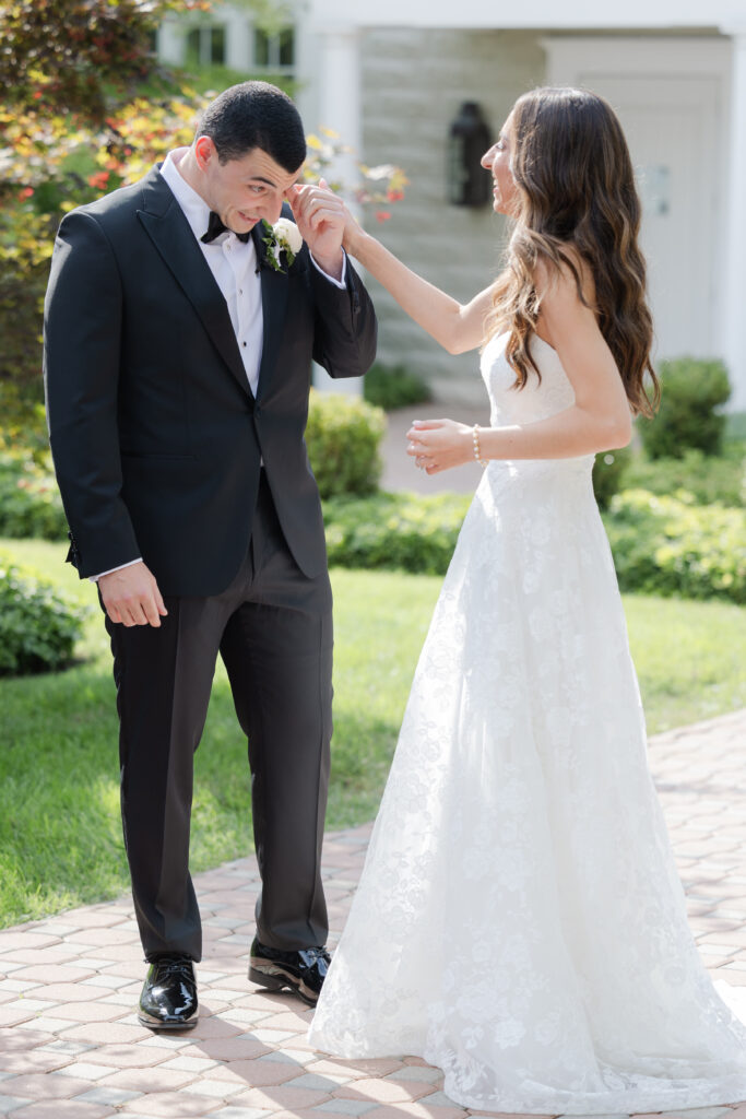 Groom first look outside of the Ryland Inn wedding venue, northern New Jersey