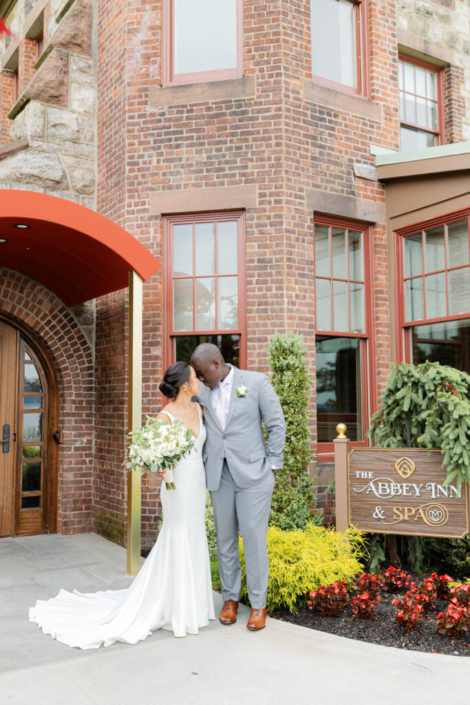 Bride and Groom in front of the Abbey Inn & Spa - an Upstate New York Wedding Venue near the Hudson Valley