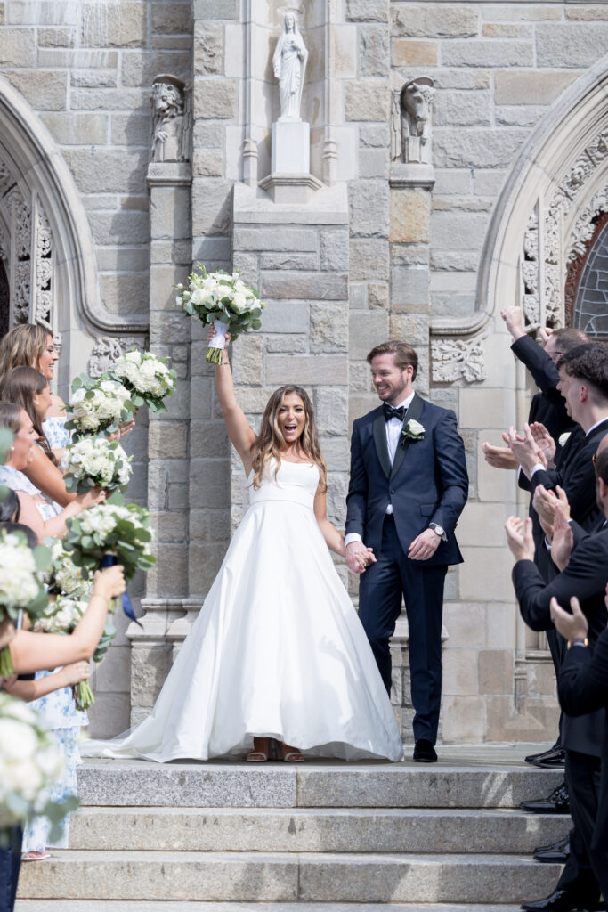 Bride and groom just married portraits outside church