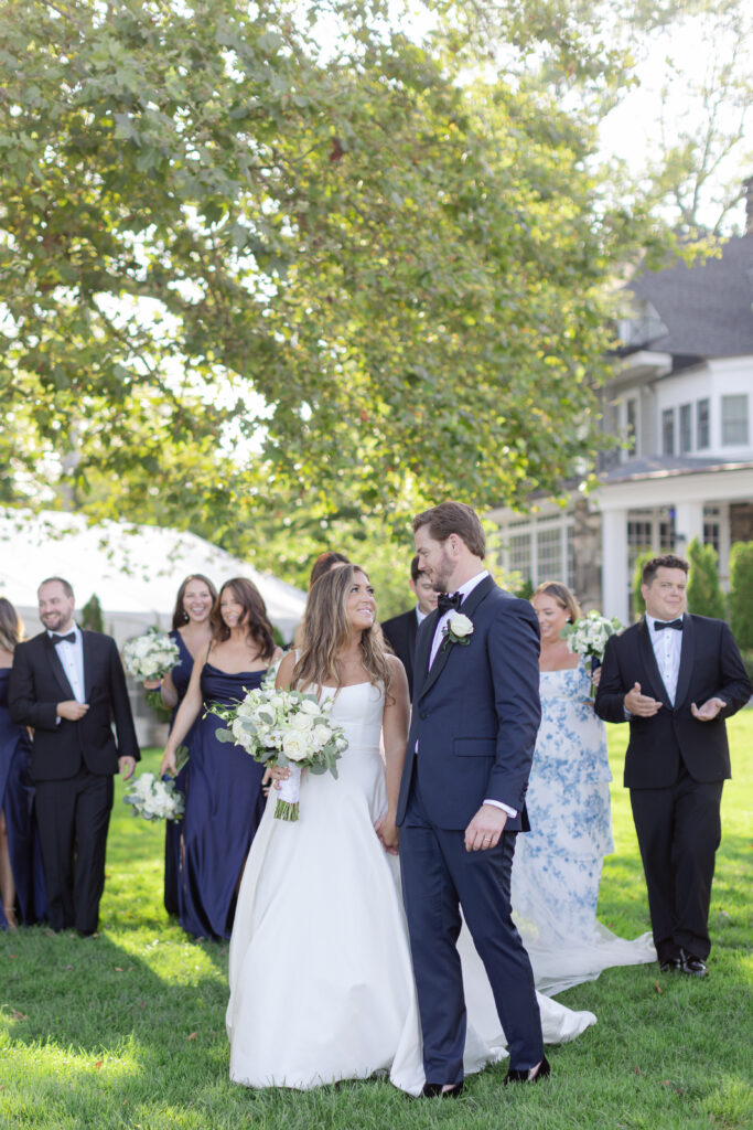 Wedding party portraits in front of Orienta Beach Club