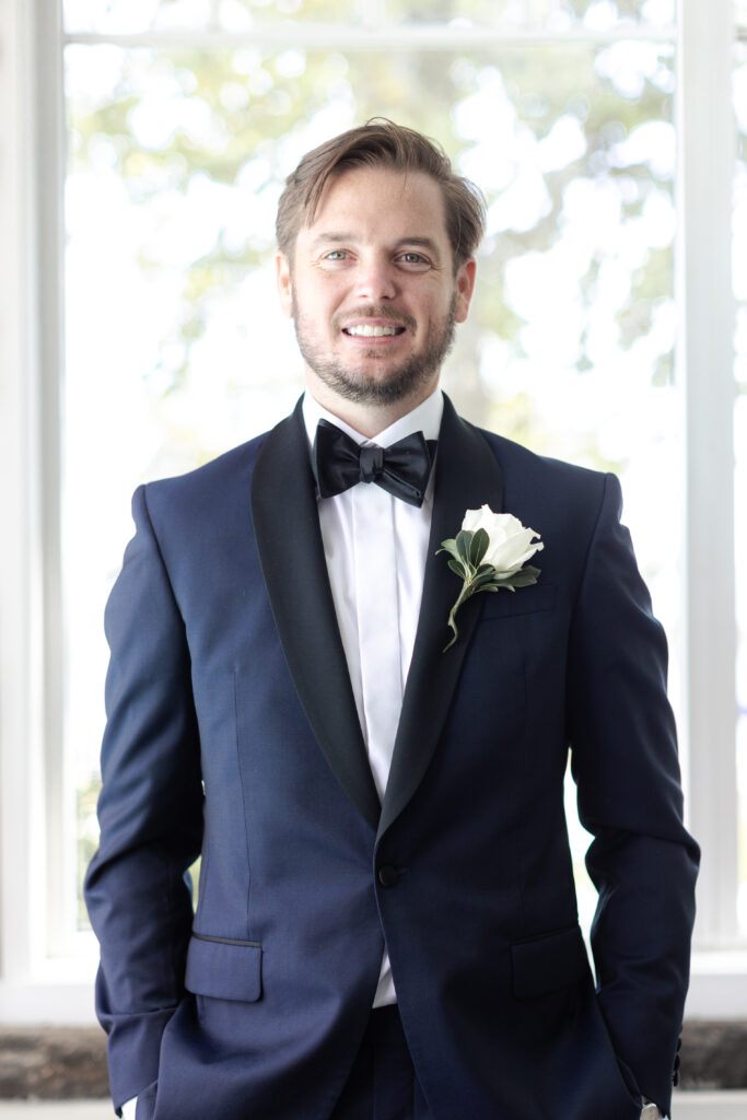 Groom portraits inside clubhouse wedding venue