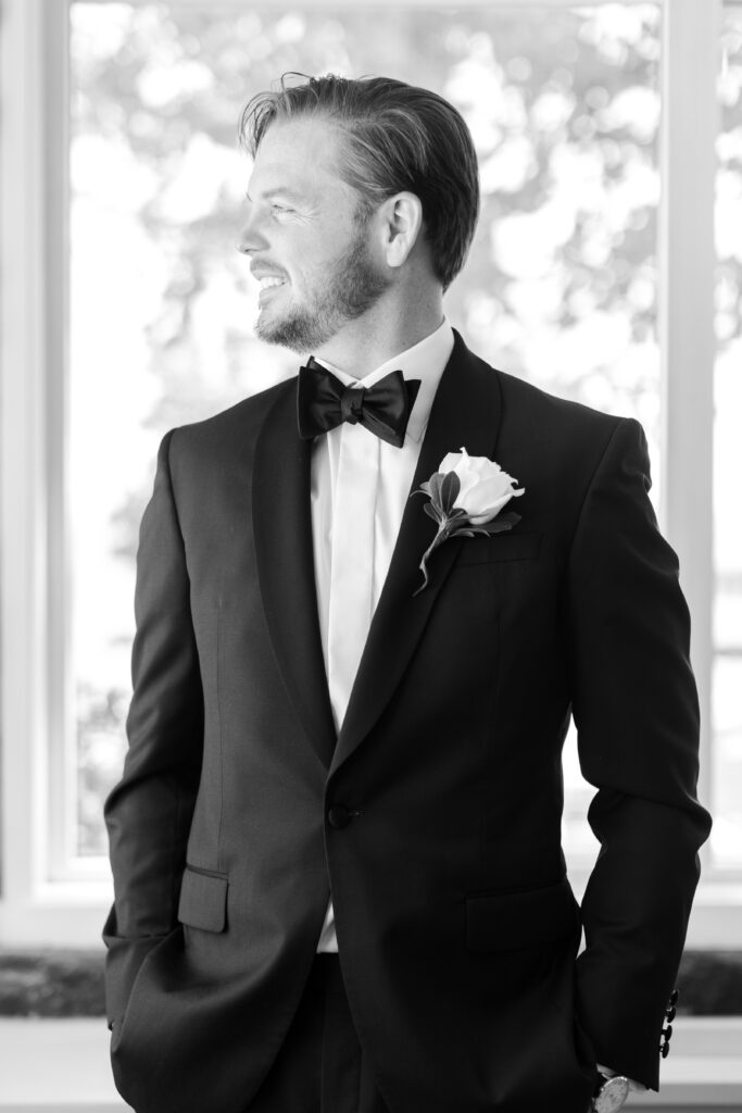 Groom portraits inside clubhouse wedding venue