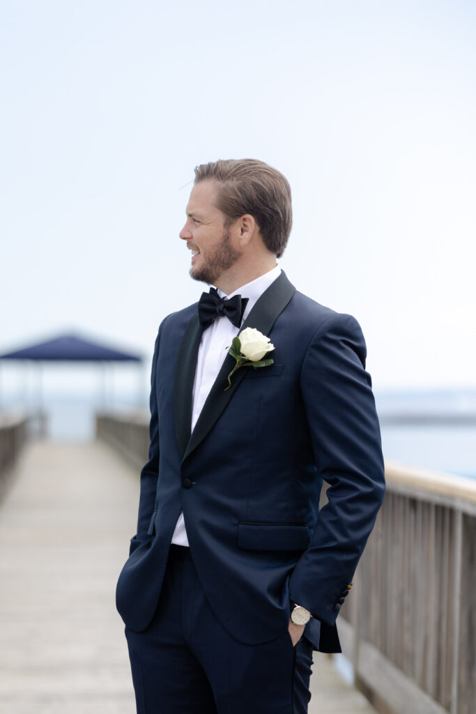 Groom portraits outside of Orienta Beach Club