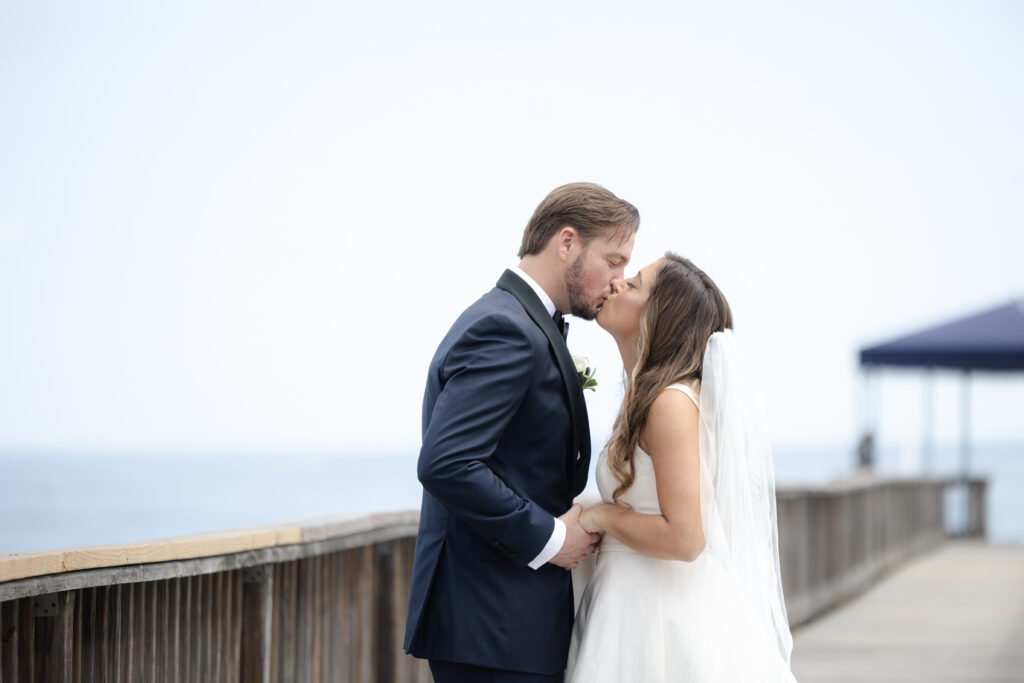 Bride and groom first look at bridge outside of clubhouse wedding venue