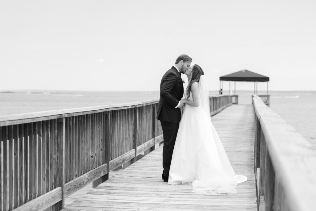 Bride and groom first look at bridge outside of clubhouse wedding venue