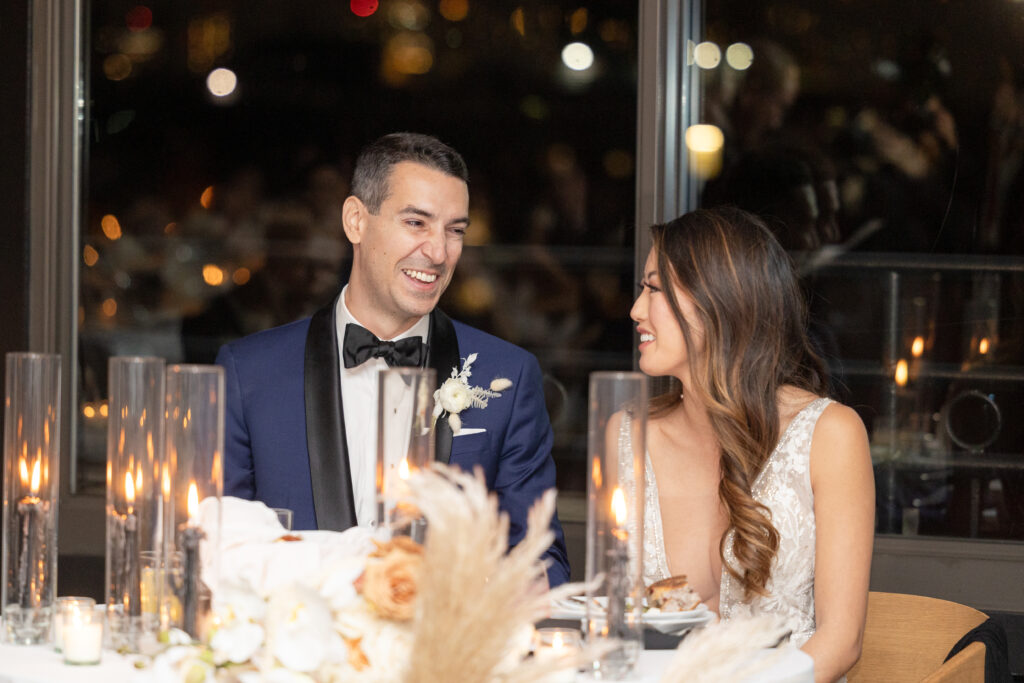 Bride and groom reacting to wedding speeches at Brooklyn wedding venue