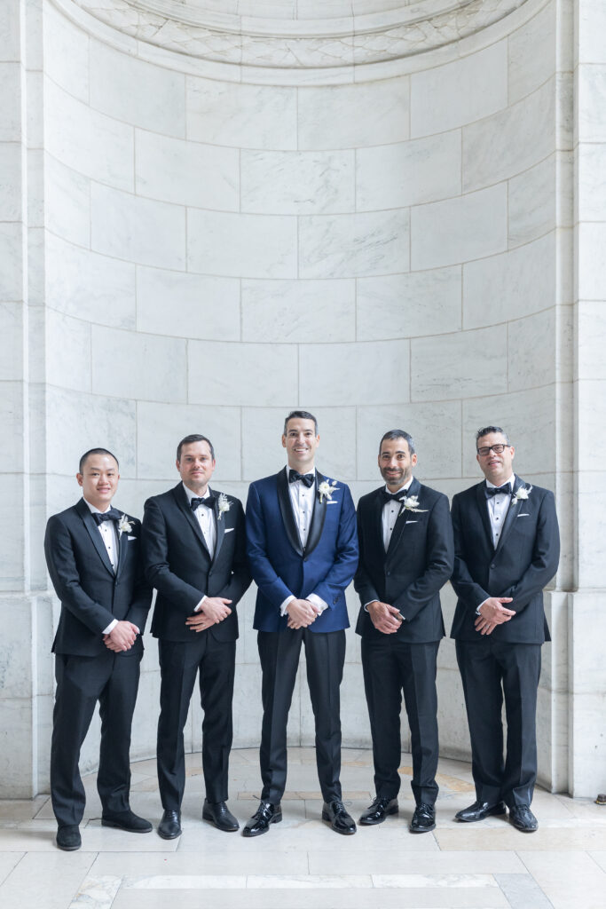 Groom and groomsmen portrait outside the NY Public Library