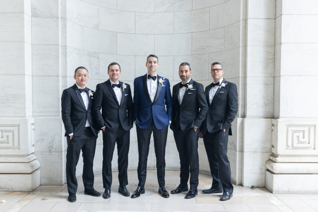 Groom and groomsmen portrait outside the NY Public Library