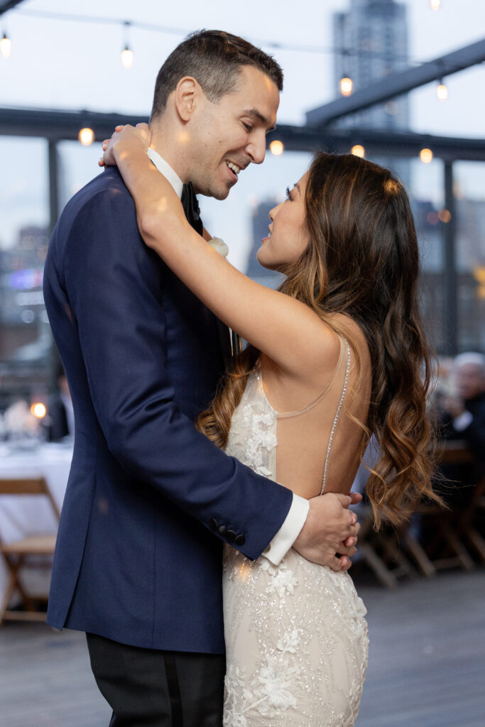 First dance of bride and groom at the rooftop of wedding event venue in Brooklyn