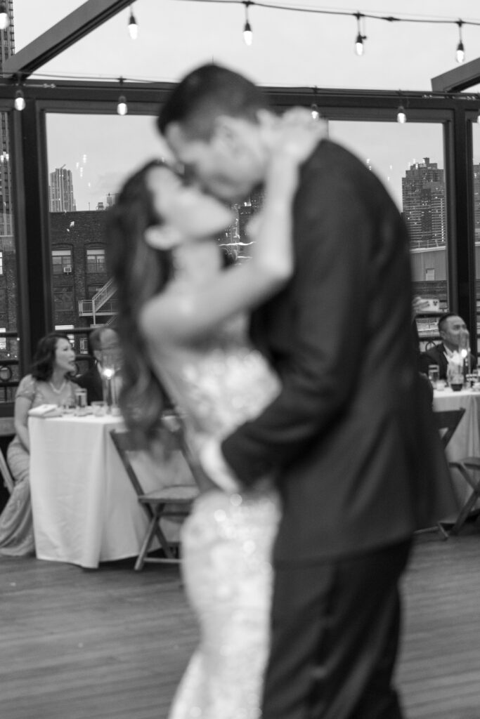 First dance of bride and groom at the rooftop of wedding event venue in Brooklyn