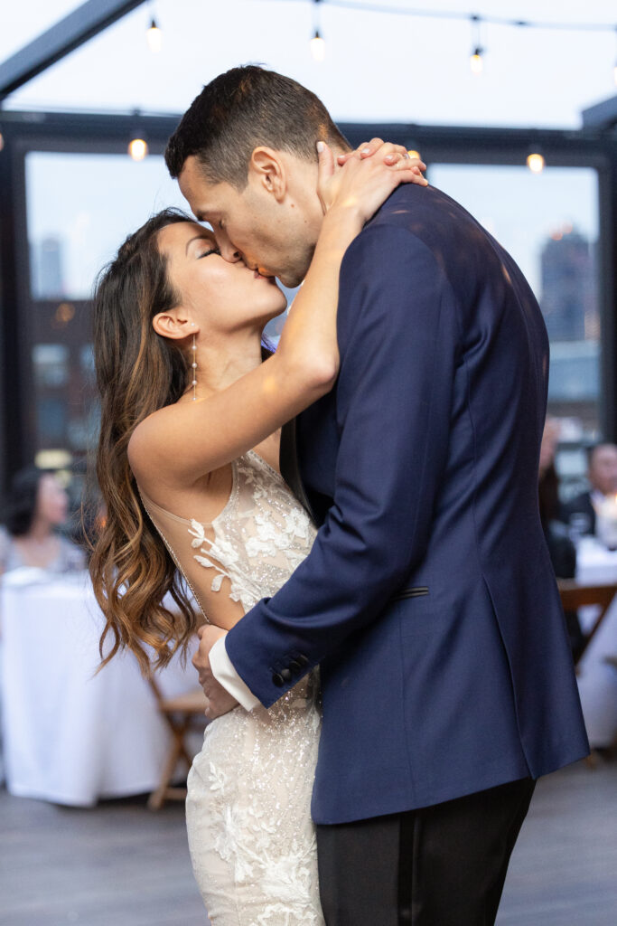 First dance of bride and groom at the rooftop of wedding event venue in Brooklyn