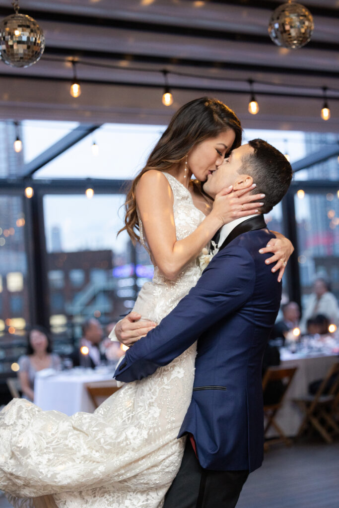 First dance of bride and groom at the rooftop of wedding event venue in Brooklyn