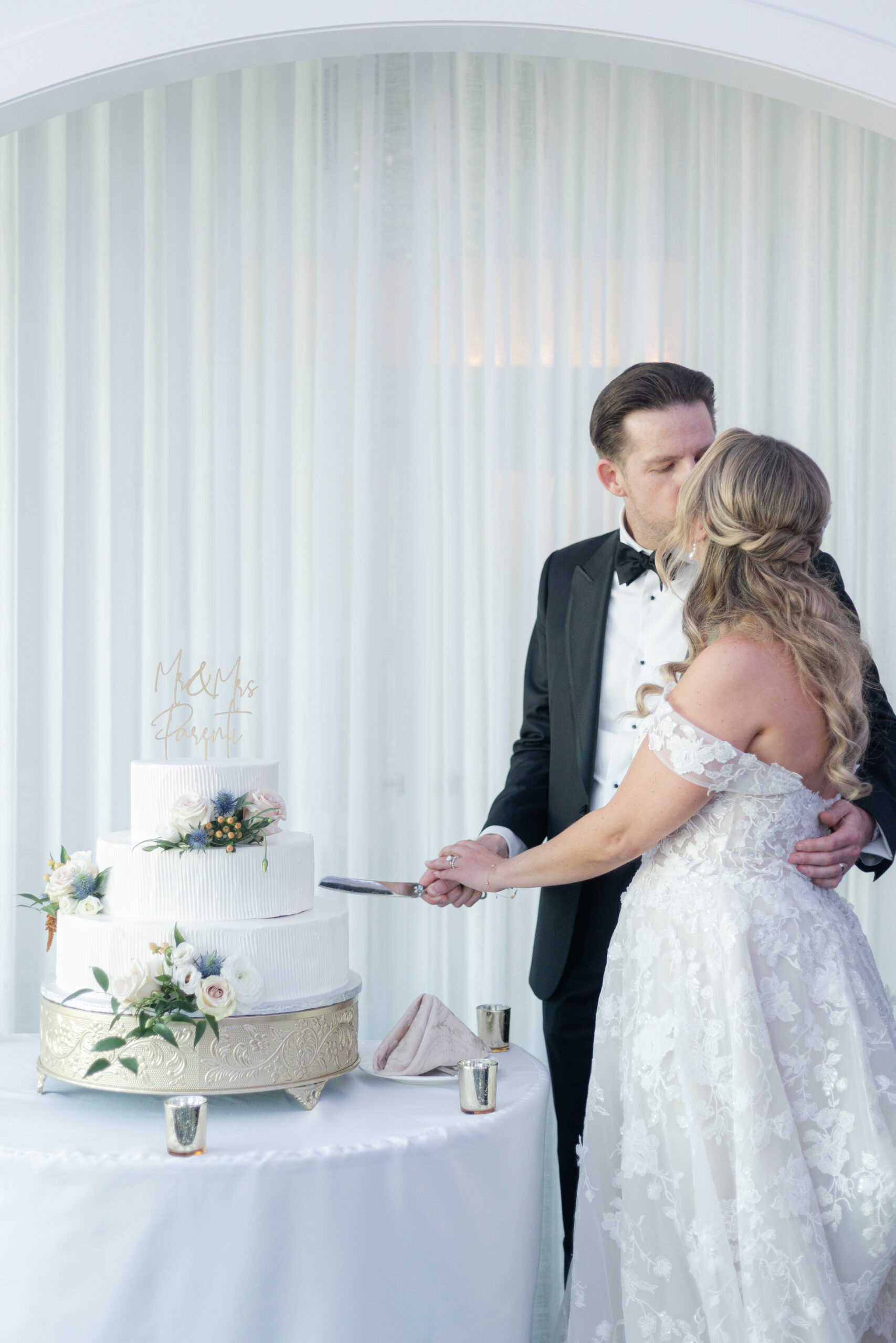 Bride and Groom Cake-Cutting Inside Wedding Reception