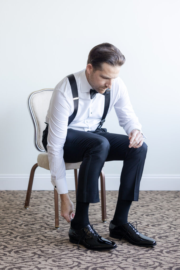 Groom Getting Ready_Shoes Shot_Inside of Yacht Club Wedding Venue