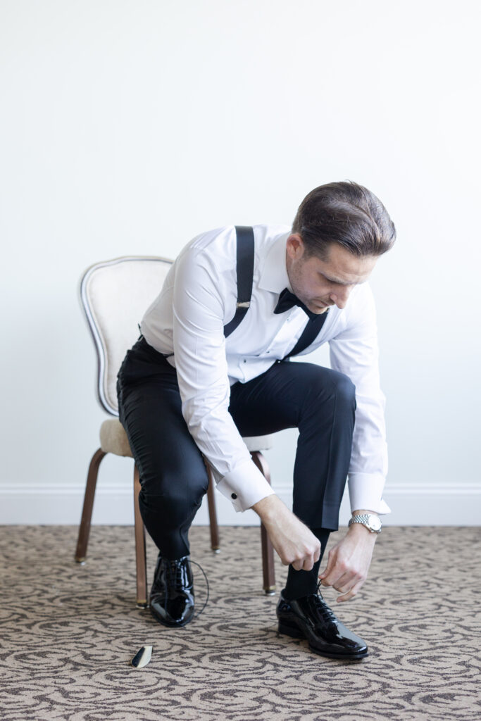 Groom Getting Ready_Shoes Shot_Inside of Yacht Club Wedding Venue