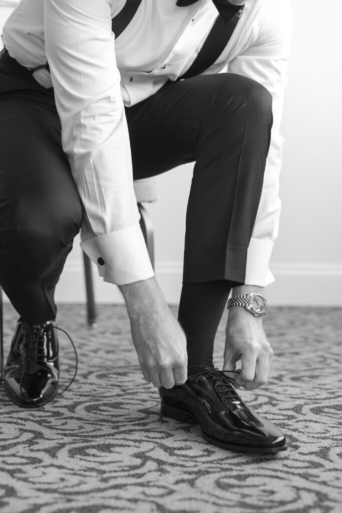 Groom Getting Ready_Shoes Shot_Inside of Yacht Club Wedding Venue