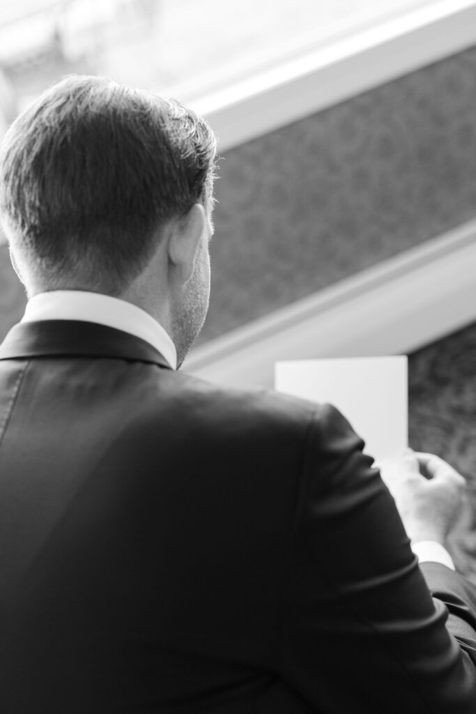 Groom Getting Ready_Reading Vows_Inside of Yacht Club Wedding Venue