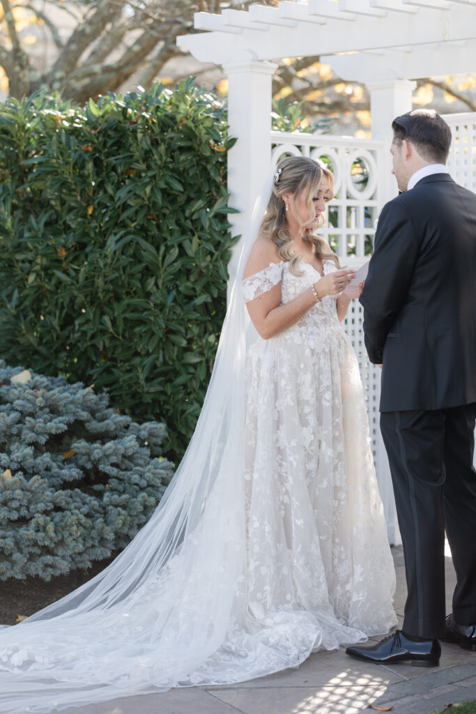 Bride and Groom_Reading Vows To Each Other Outside Venue