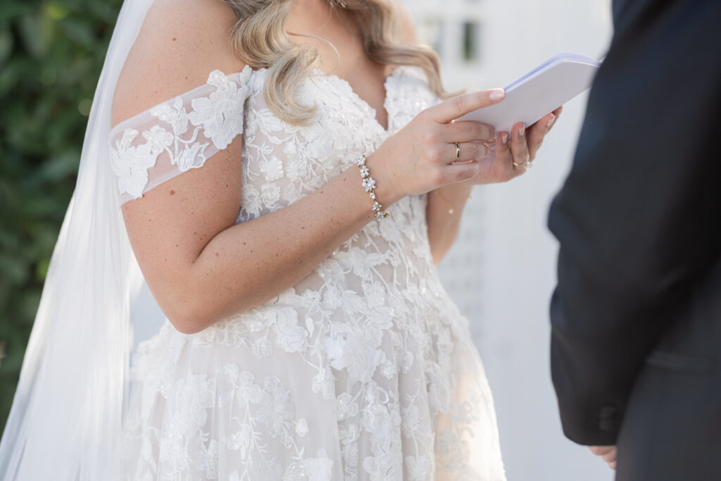 Bride and Groom_Reading Vows To Each Other Outside Venue