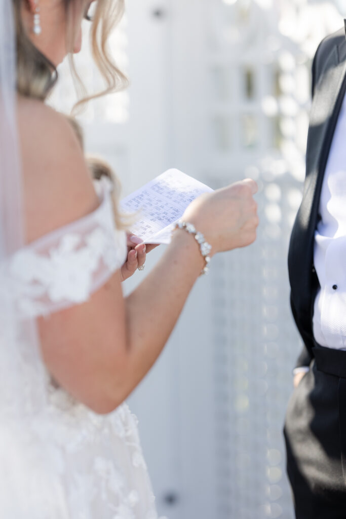 Bride and Groom_Reading Vows To Each Other Outside Venue