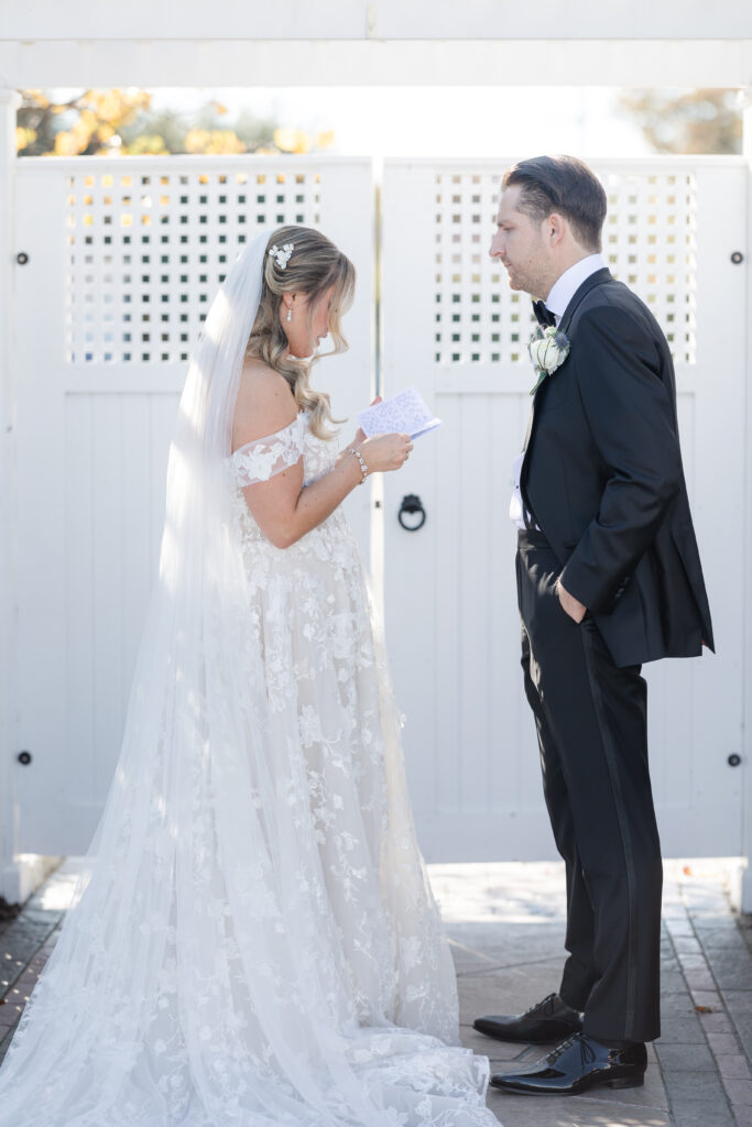 Bride and Groom_Reading Vows To Each Other Outside Venue