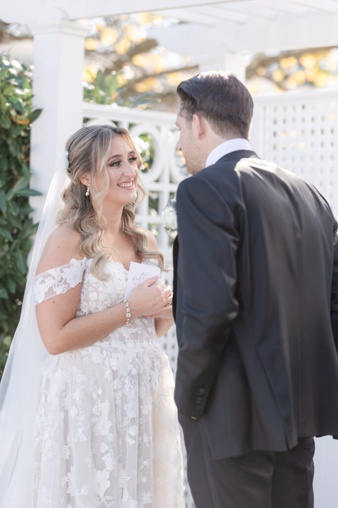 Bride and Groom_Reading Vows To Each Other Outside Venue