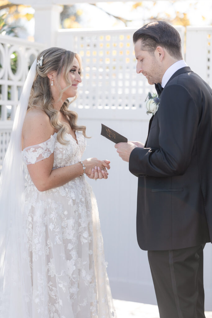 Bride and Groom_Reading Vows To Each Other Outside Venue