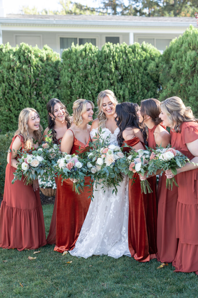 Bride and Bridesmaid Outdoor Portraits at Yacht Club Wedding Venue 