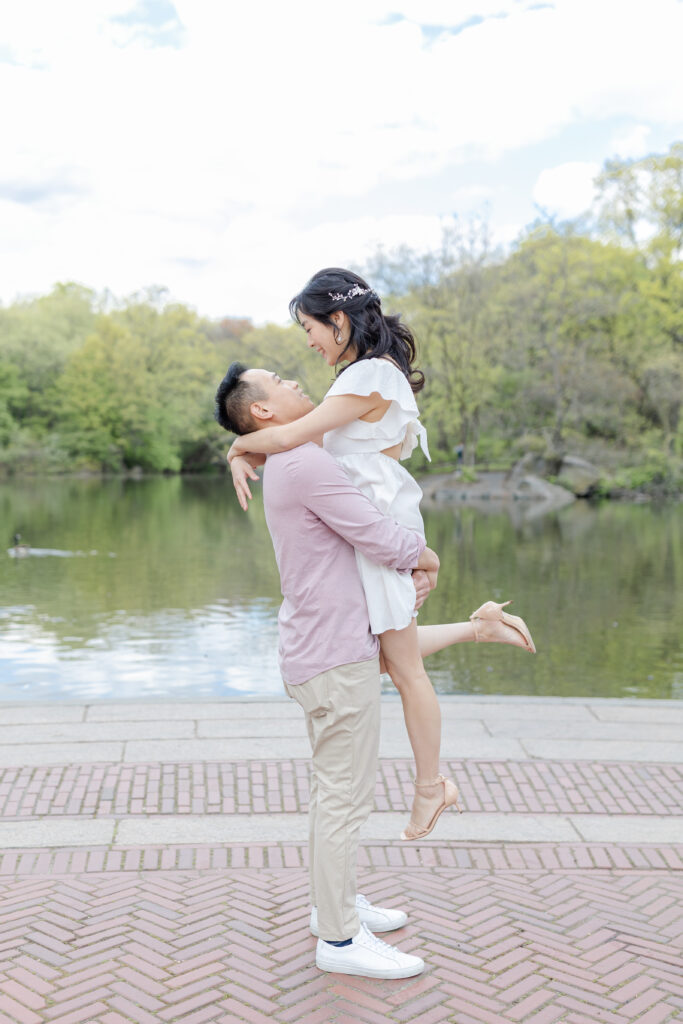 Romantic engagement session in front of Central Park Boathouse