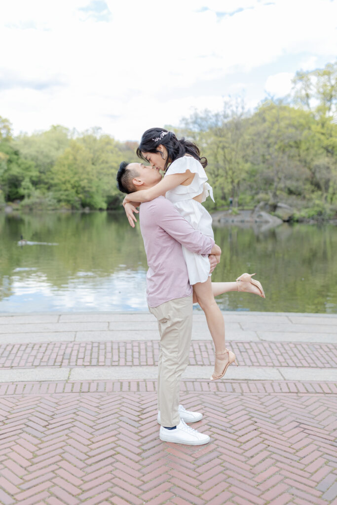 Romantic engagement session in front of Central Park Boathouse