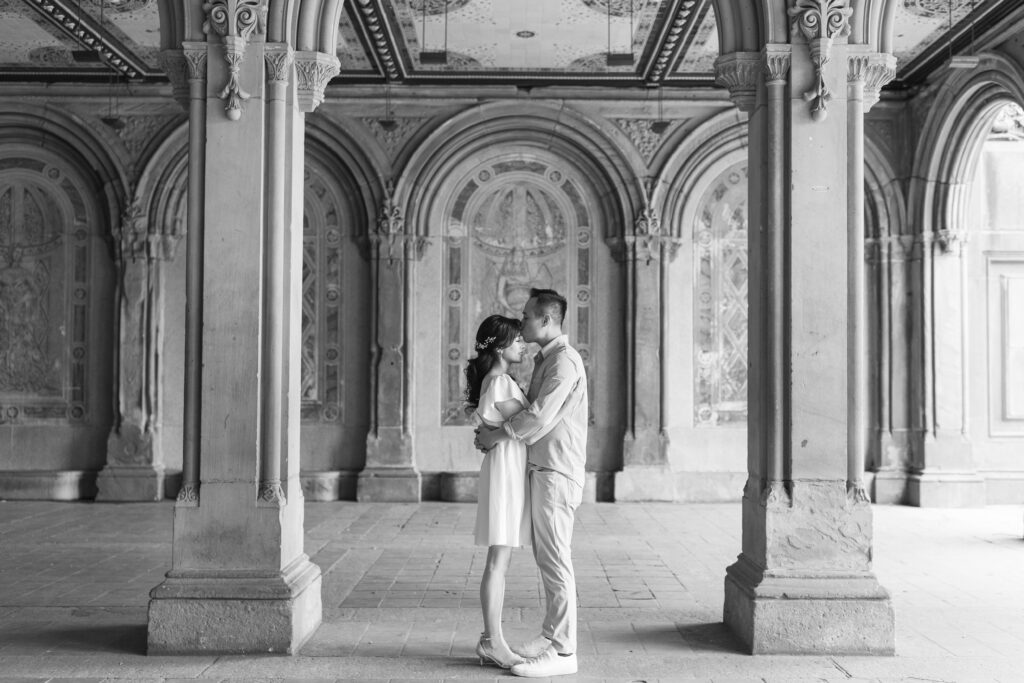 Black and white couple photos against Bethesda Terrace backdrop