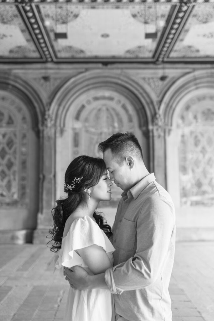 Black and white couple photos against Bethesda Terrace backdrop