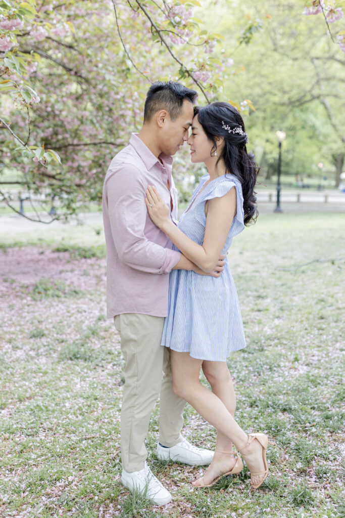 Engagement session near cherry blossom trees