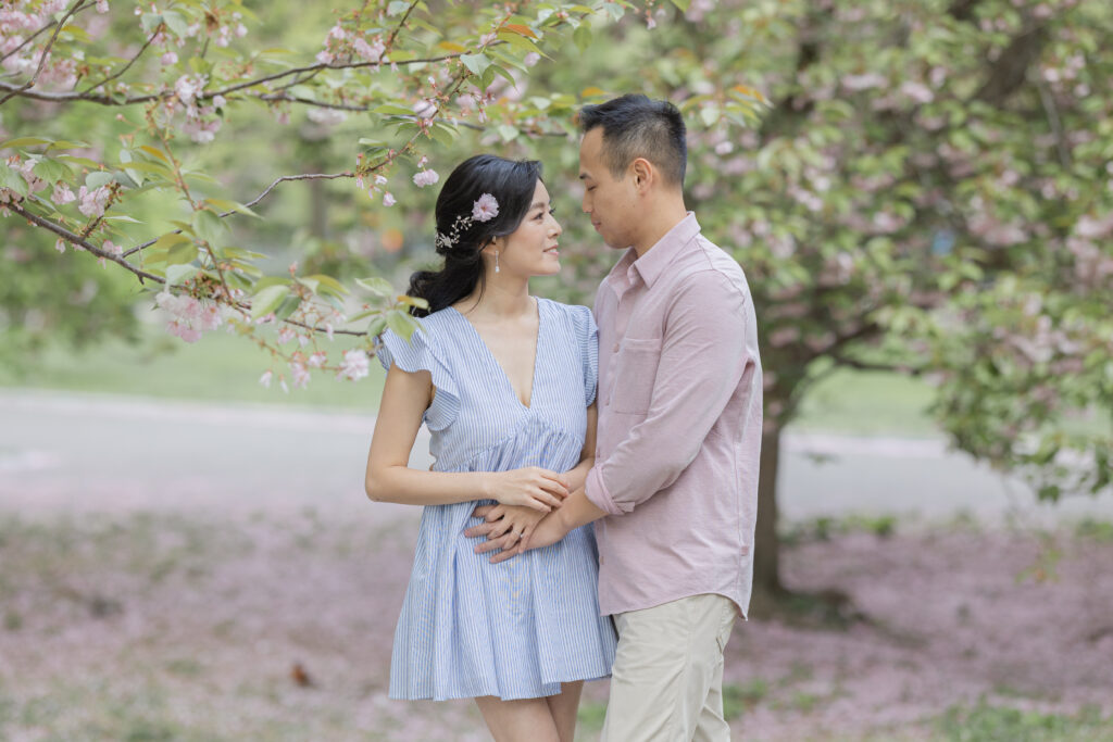 Engagement session near cherry blossom trees