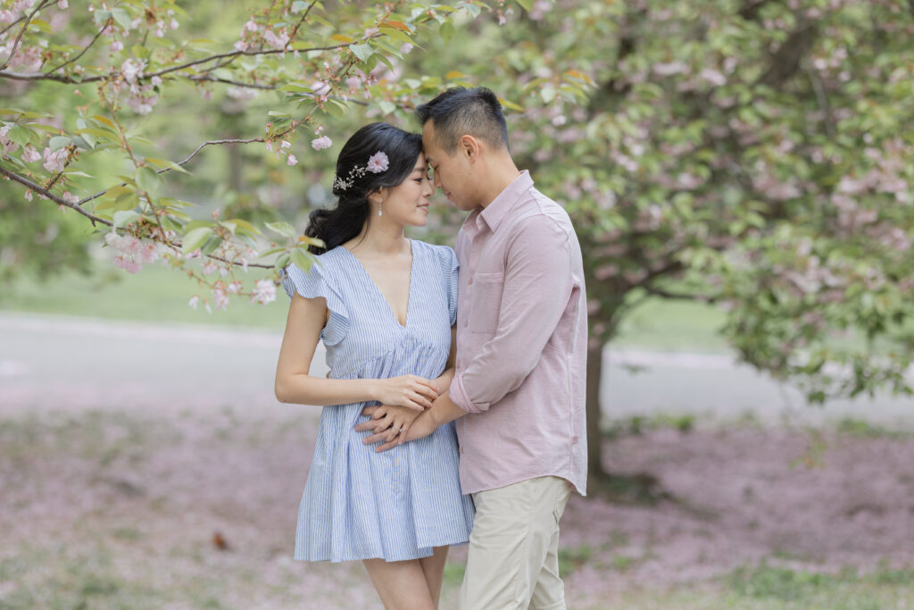 Engagement session near cherry blossom trees